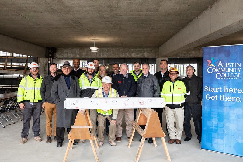 Group photo of members of the construction team that worked on the Highland Campus Parking Garage and members of Austin Community College. 