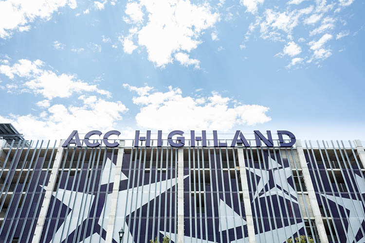 ACC Highland in large block letters installed on the East facing side of the Highland Campus parking garage.