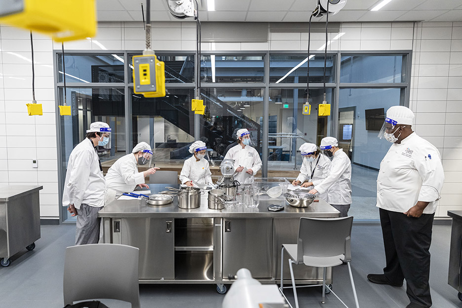 Chef Bryant Currie, right, teaches a Basic Food Prep class during the first day of spring 2021 semester inside the Demonstration Kitchen at the Highland Campus, Building 2000.