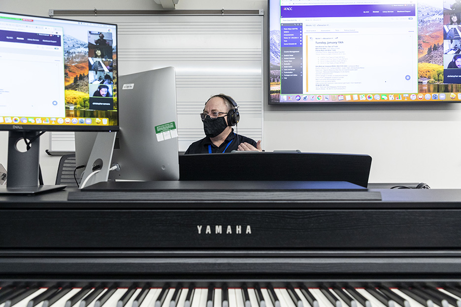 Shane Anderson, ACC Music Department chair and professor, teaches a hybrid piano class on the first day of the spring 2021 semester at the Highland Campus, Building 2000. 