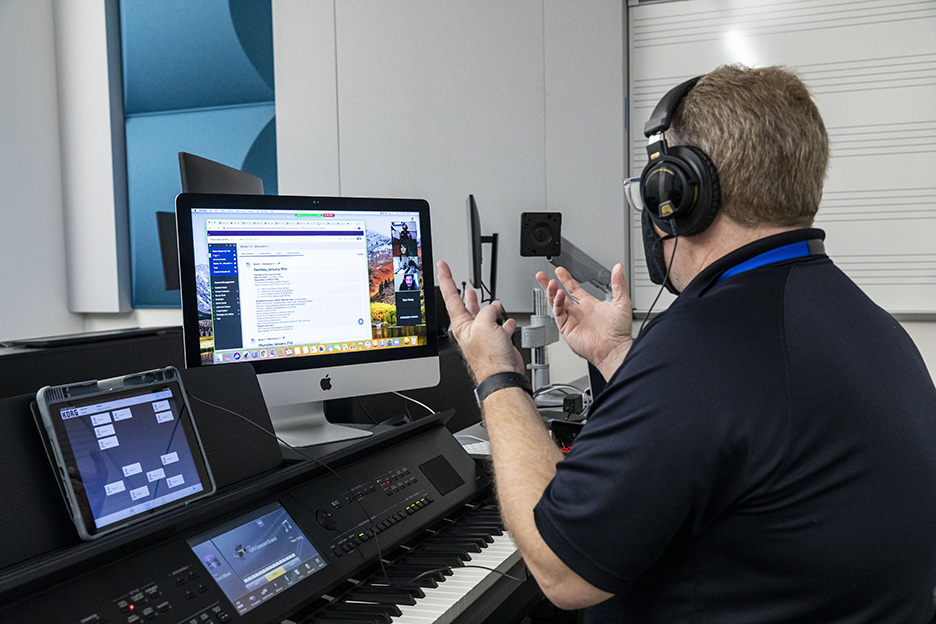 Shane Anderson, ACC Music Department chair and professor, teaches a hybrid piano class on the first day of the spring 2021 semester at the Highland Campus, Building 2000. 