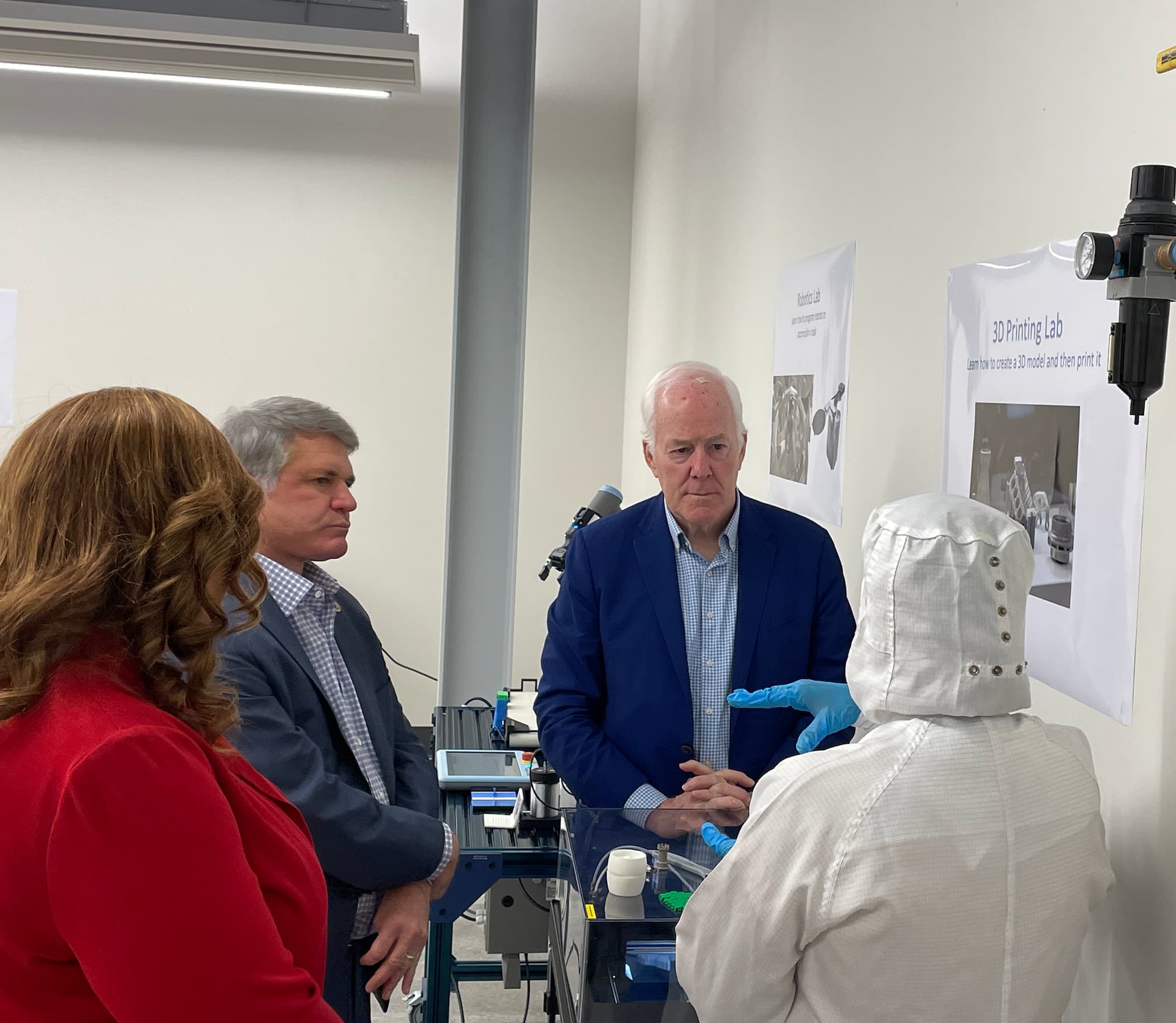 Senator Cornyn, Representative McCaul, & Dr. Umphrey watch student demonstration