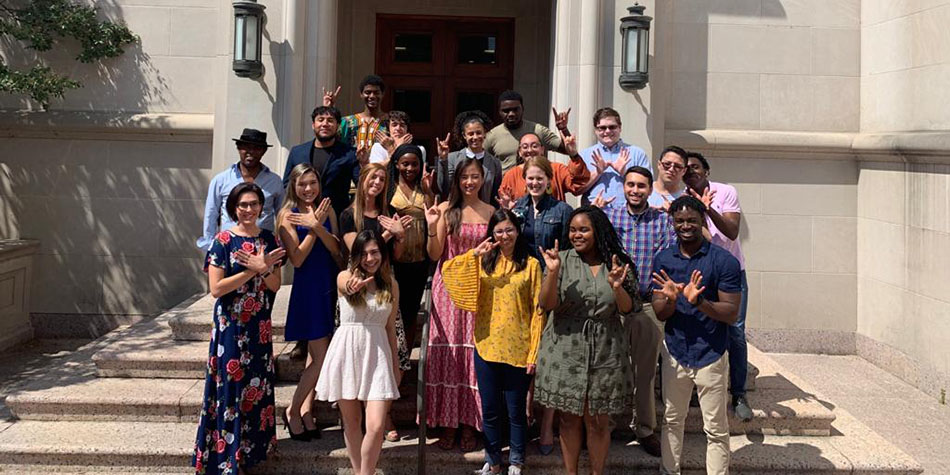 Sarah Alanis and a group of students abroad.