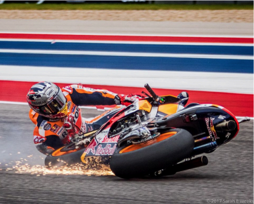 A motorcycle rider crashes during the 2017 MotoGP. 